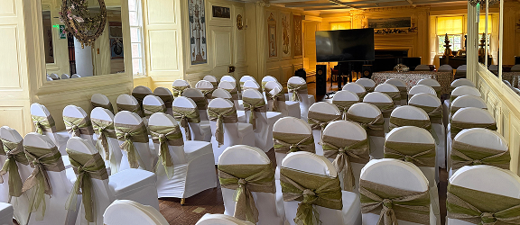 Empty seating in the Long Gallery ready for conference at Fingask Castle